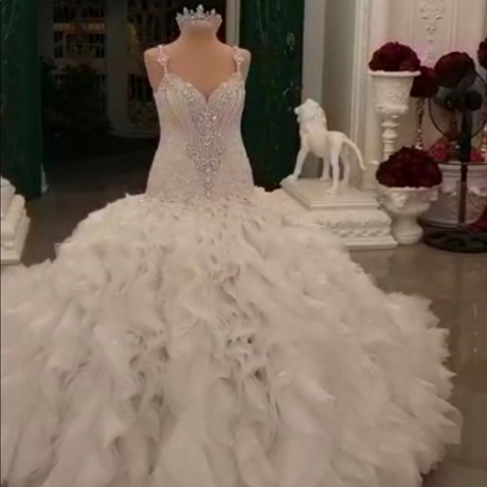 Custom made Leo Almodal dress worn once for approx. 3 hours. during a wedding.